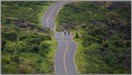 LGPmaui6796 Cyclests road riding Maui's lava covered landscape.   Maui, HI., USA